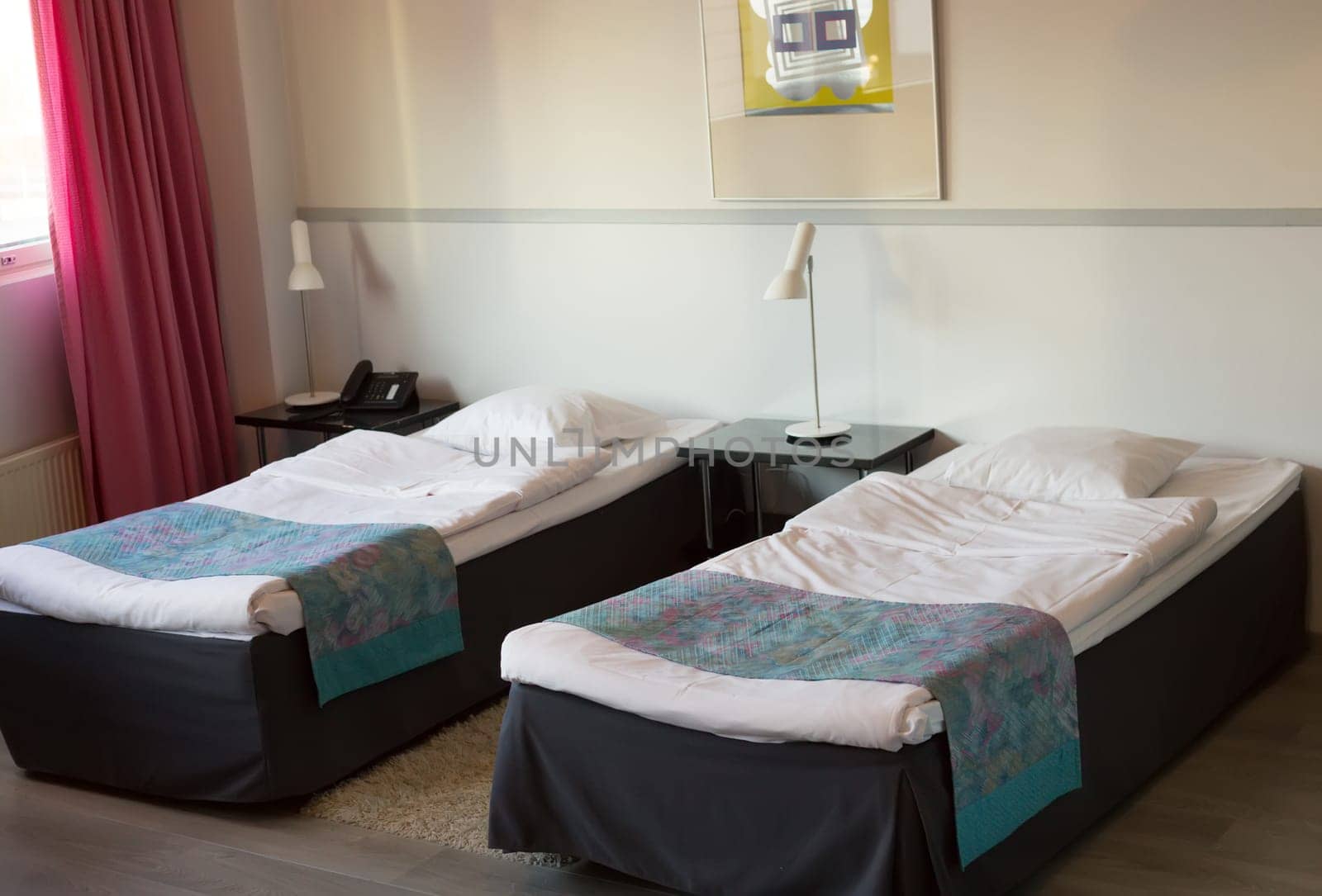 Hotel room with two beds.