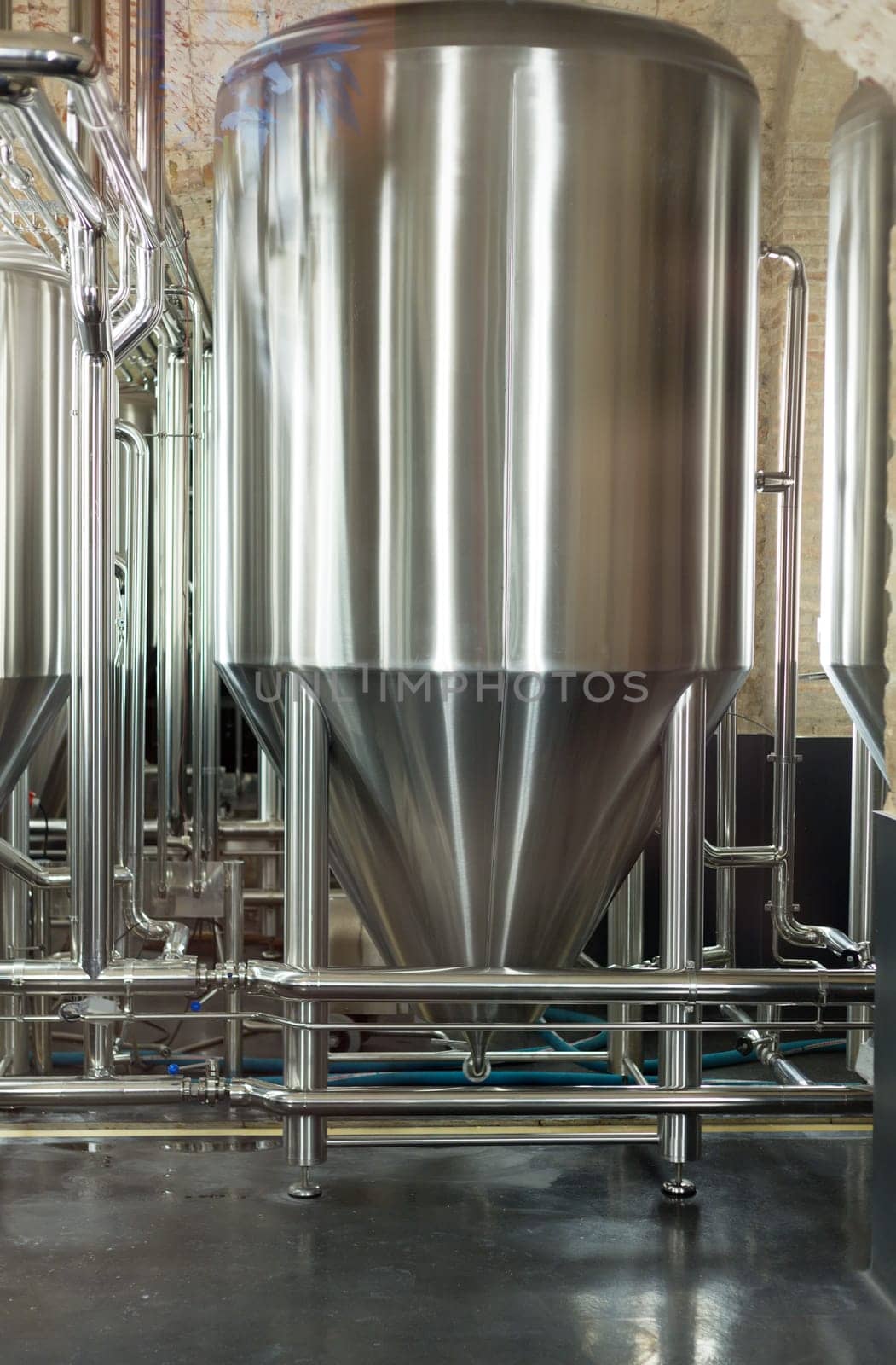Stainless steel tank at the brewery for the fermentation of beer.