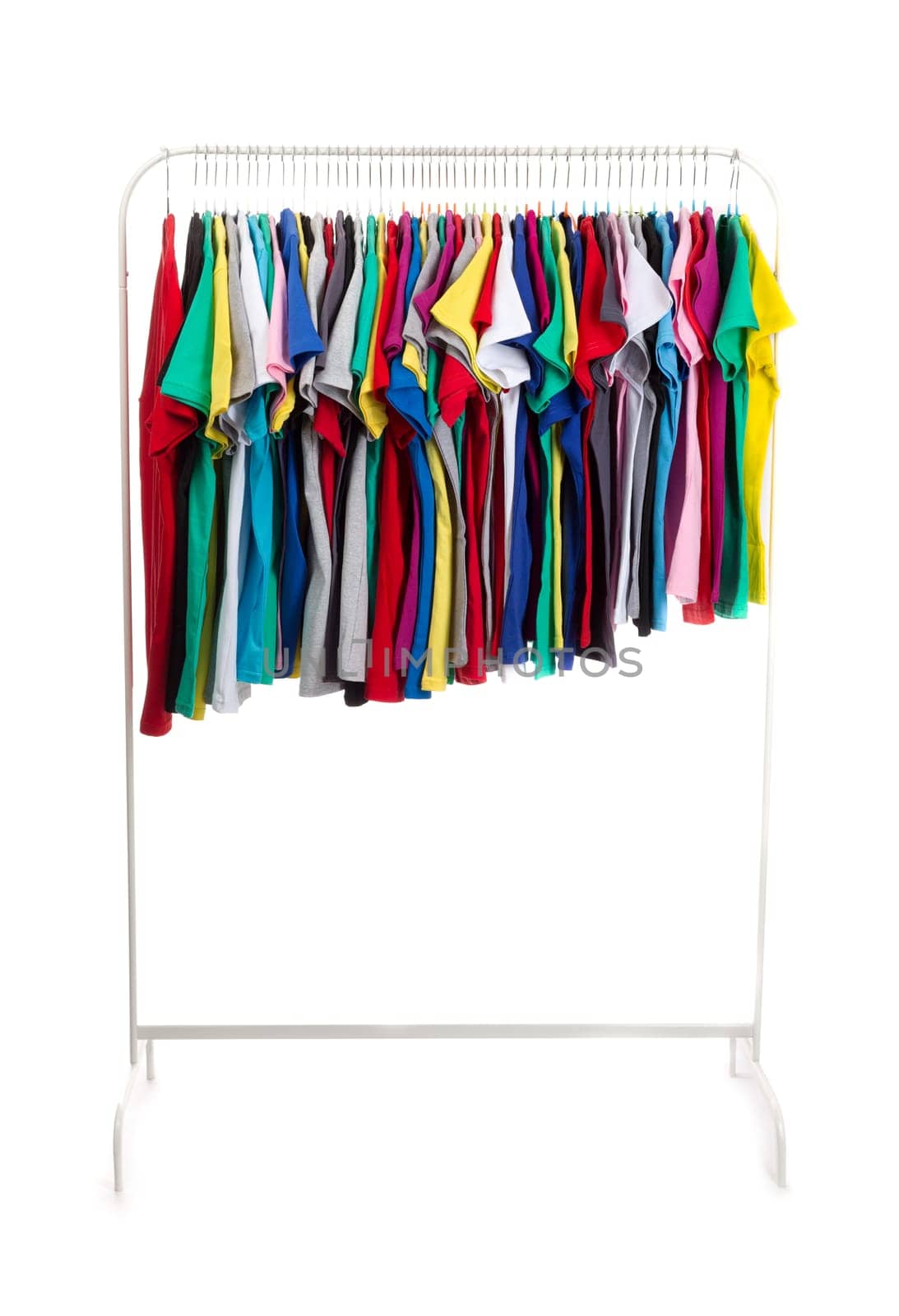 Variety of multicolored casual clothes on hangers, isolate on white background.