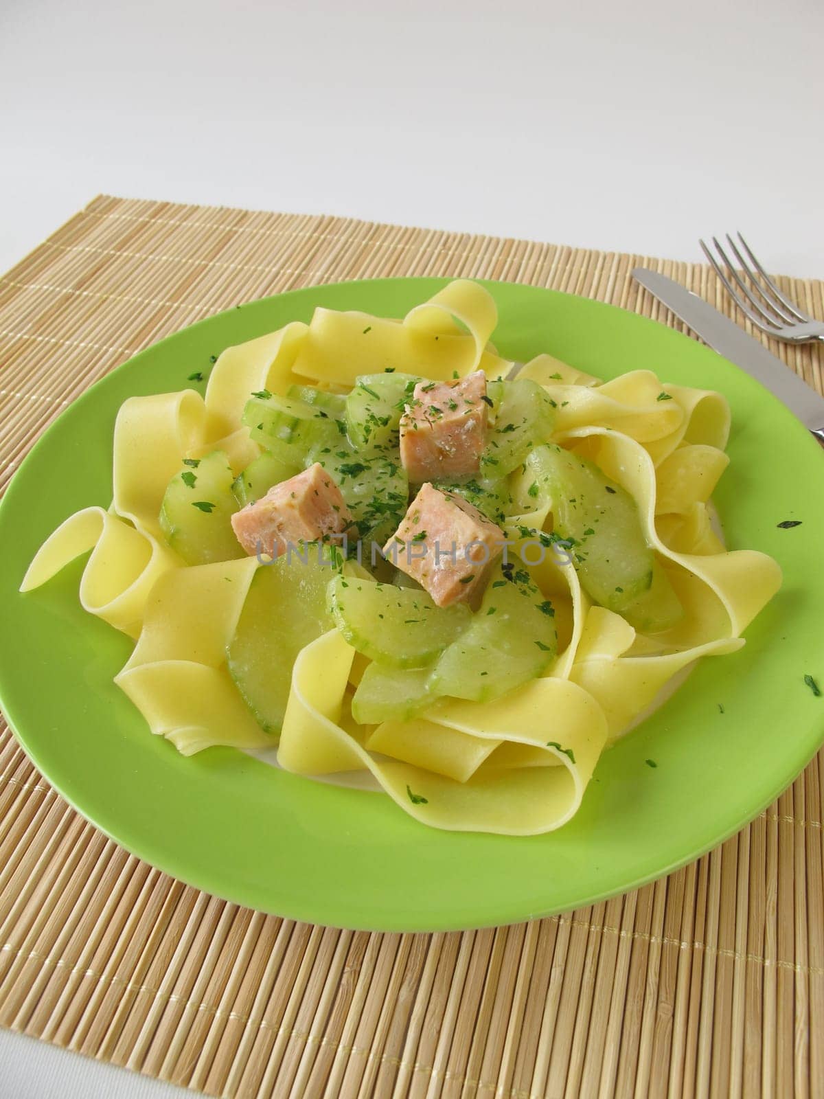 Ribbon noodles with cucumber vegetables and salmon