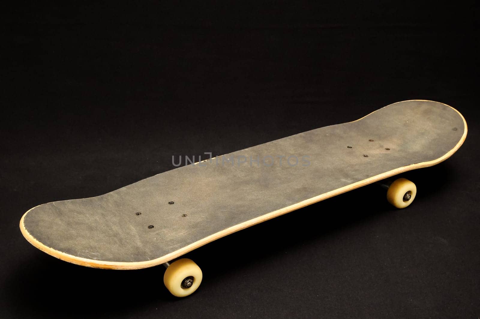 Vintage Style Black Skateboard on a black Background