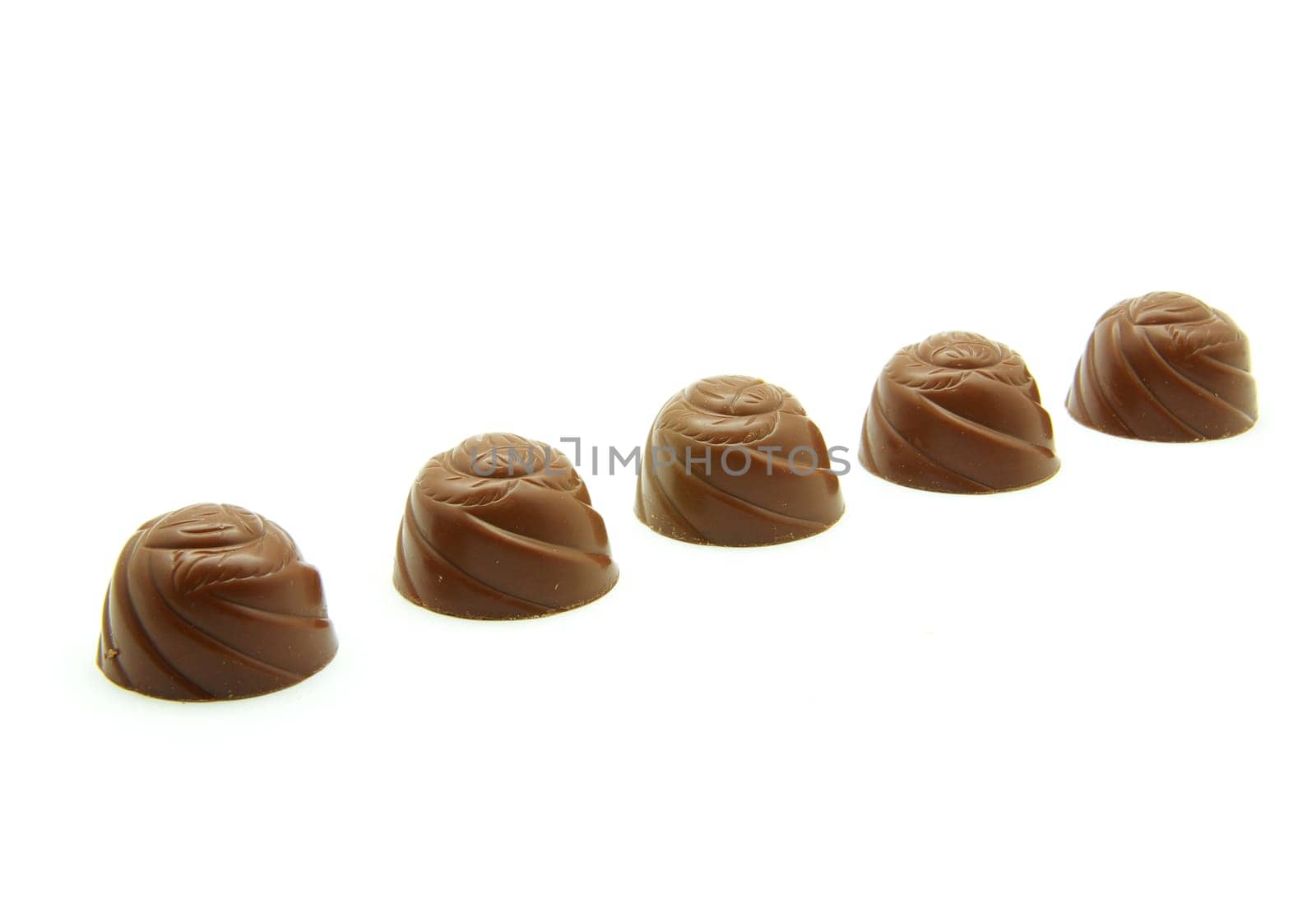 Delicious  chocolate pralines isolated on white