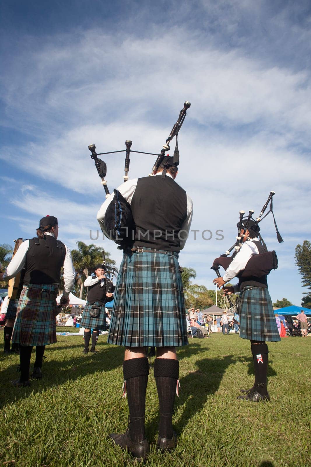 Scottish bands men and women play musical instruments in traditional Scottish clan colors dress at the Scottish Highland Gathering in Toti Durban South Africa