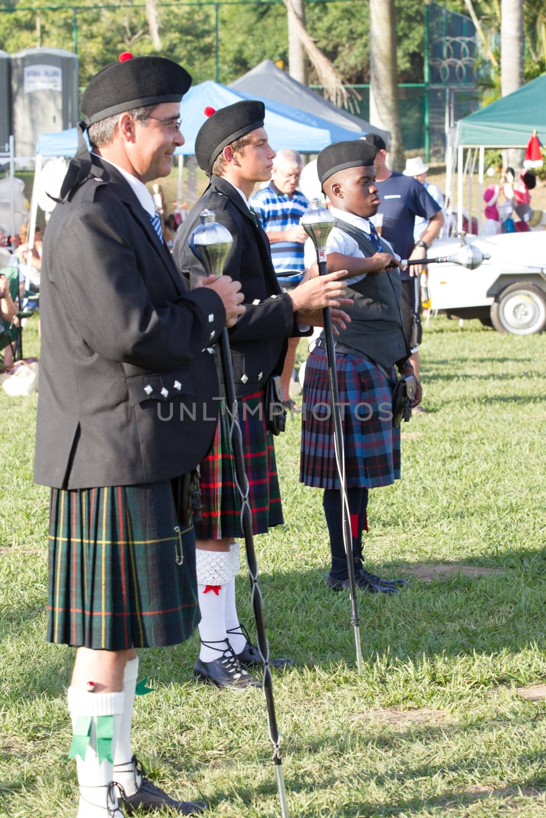 Scottish bands men and women play musical instruments in traditional Scottish clan colors dress at the Scottish Highland Gathering in Toti Durban South Africa