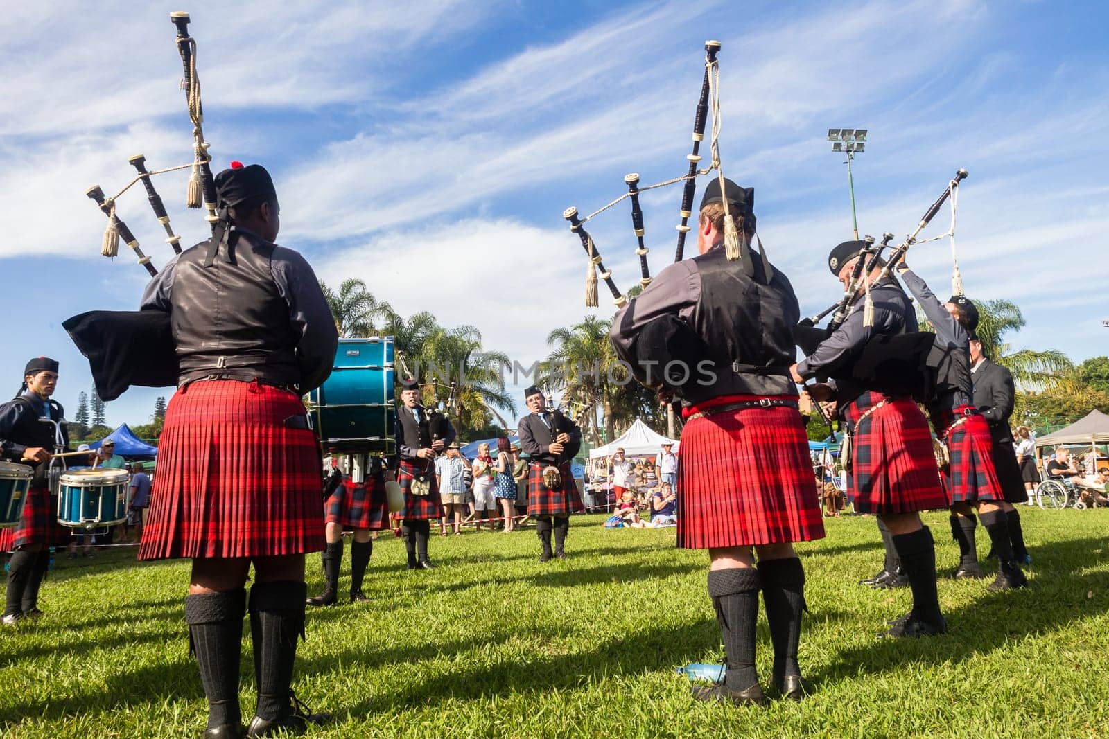 Scottish bands men and women play musical instruments in traditional Scottish clan colors dress at the Scottish Highland Gathering in Toti Durban South Africa