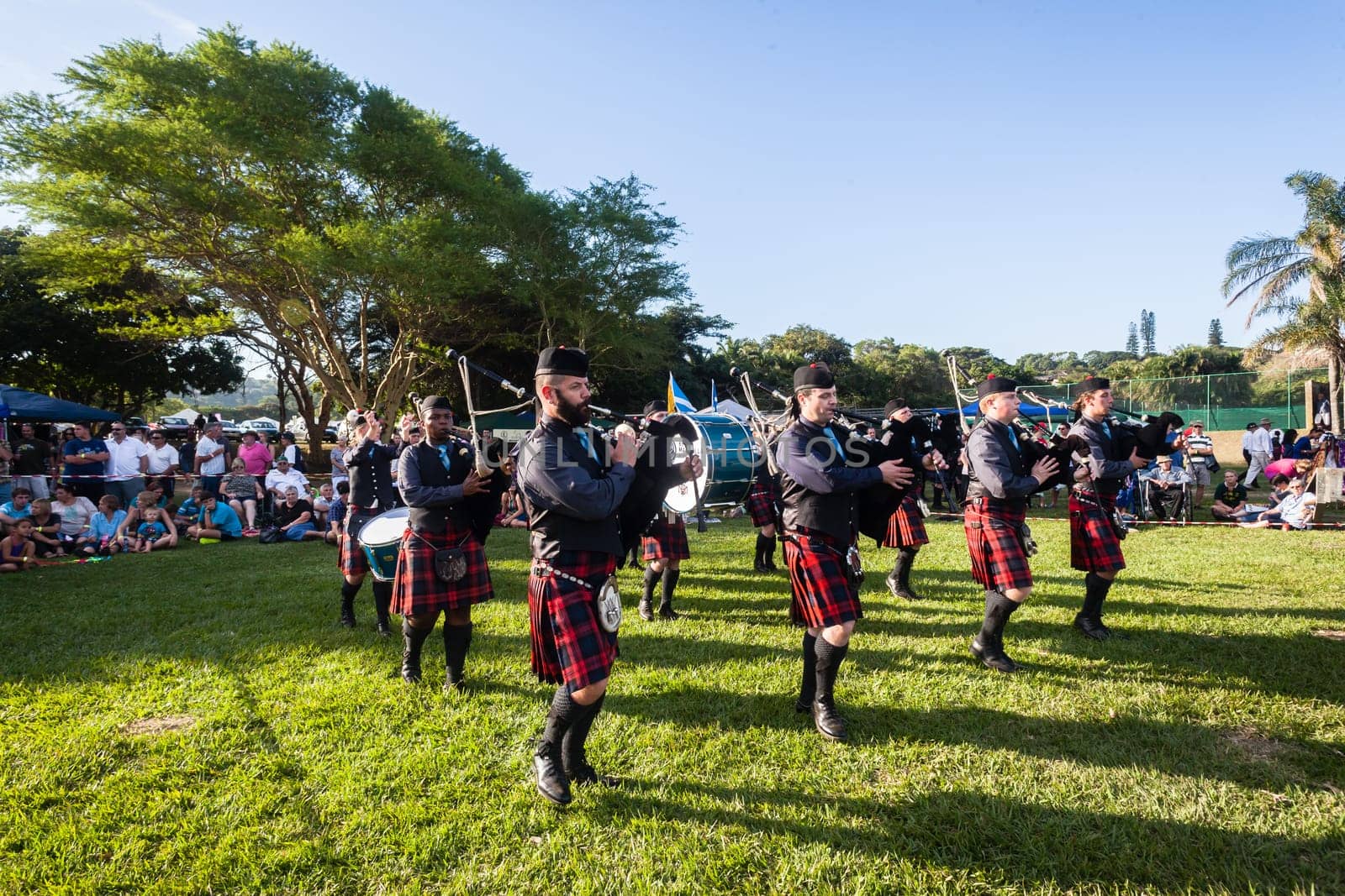Scottish bands men and women play musical instruments in traditional Scottish clan colors dress at the Scottish Highland Gathering in Toti Durban South Africa