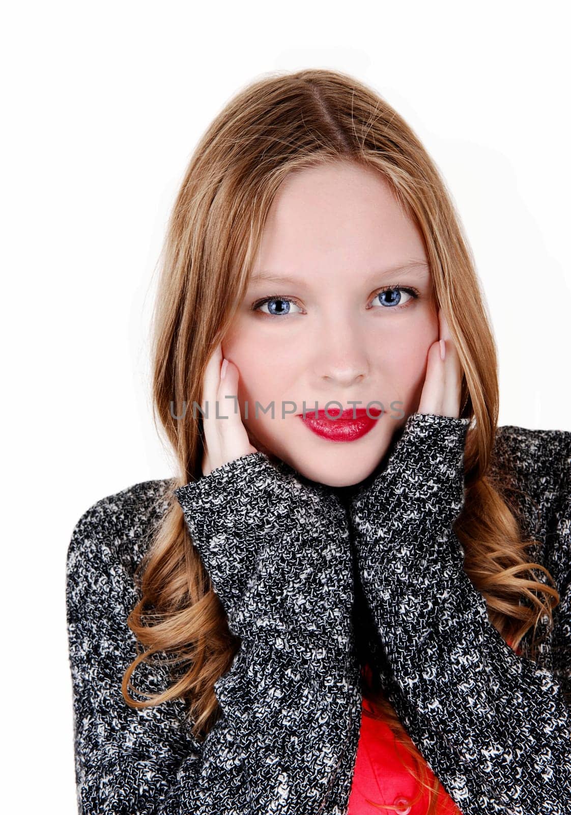 A young woman in a blue-grey sweater holding her hands on her face, .isolated for white background..