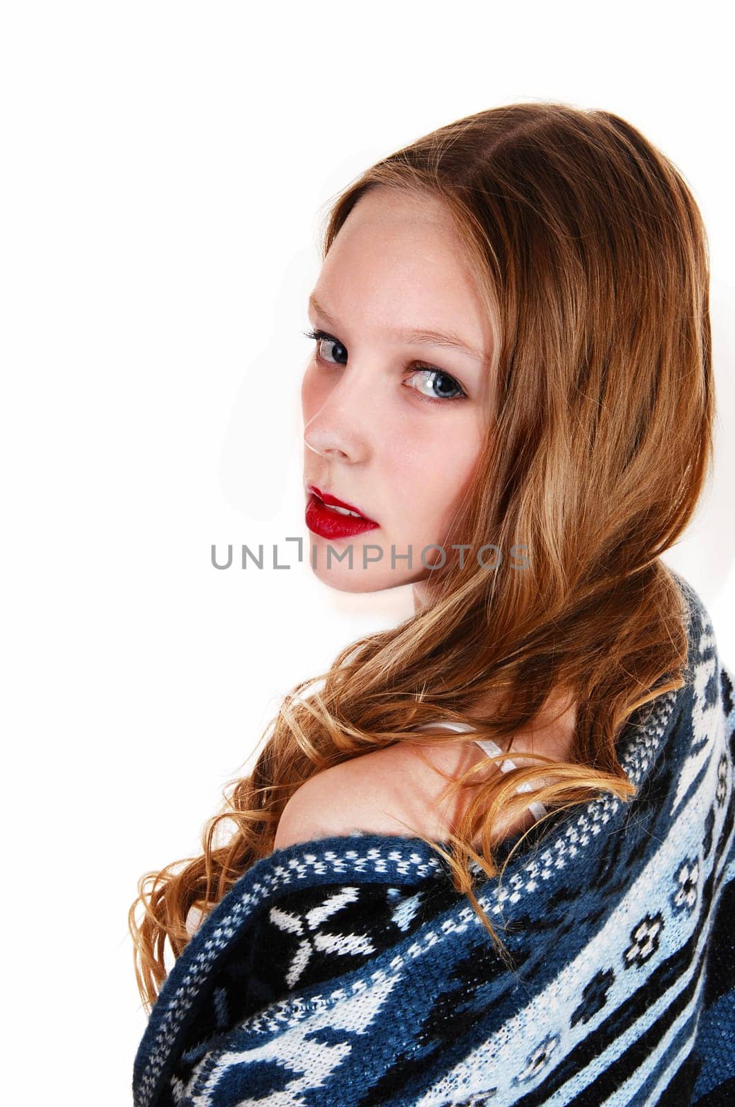 A young woman in a blue-grey sweater looking over her shoulder, .isolated for white background..