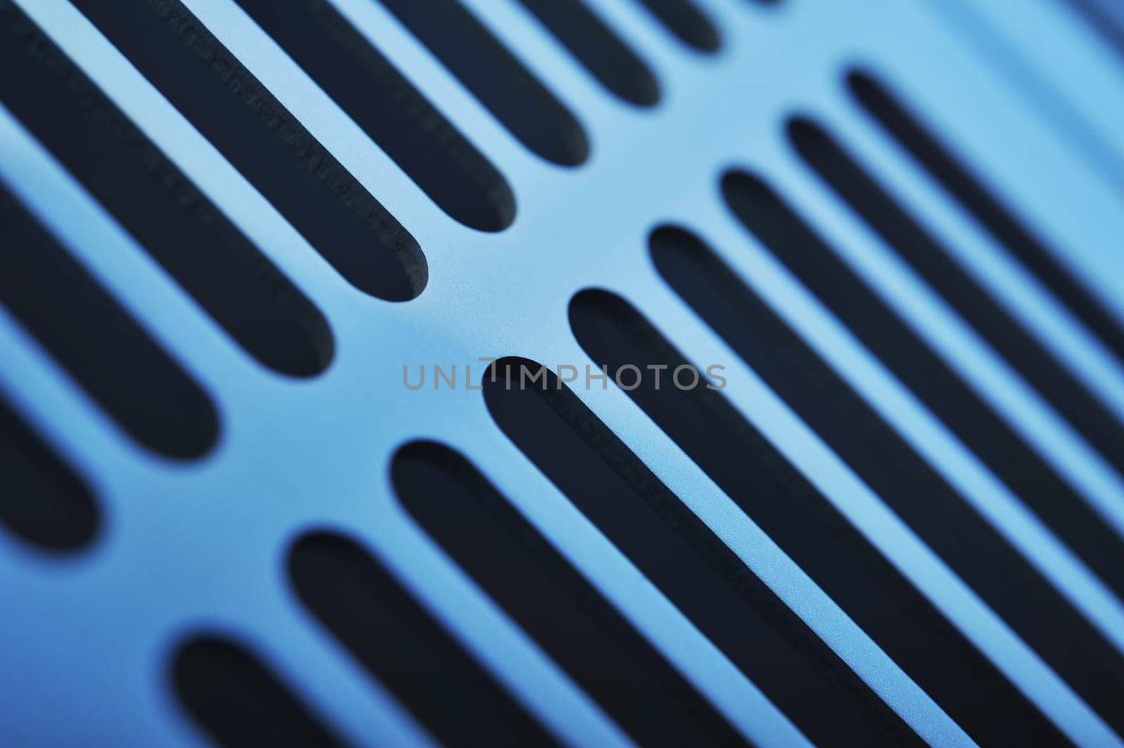 abstract industrial background made of aluminium ventilation grilles