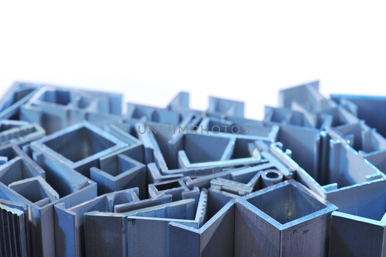 many different aluminium profile strips in blue spotlight