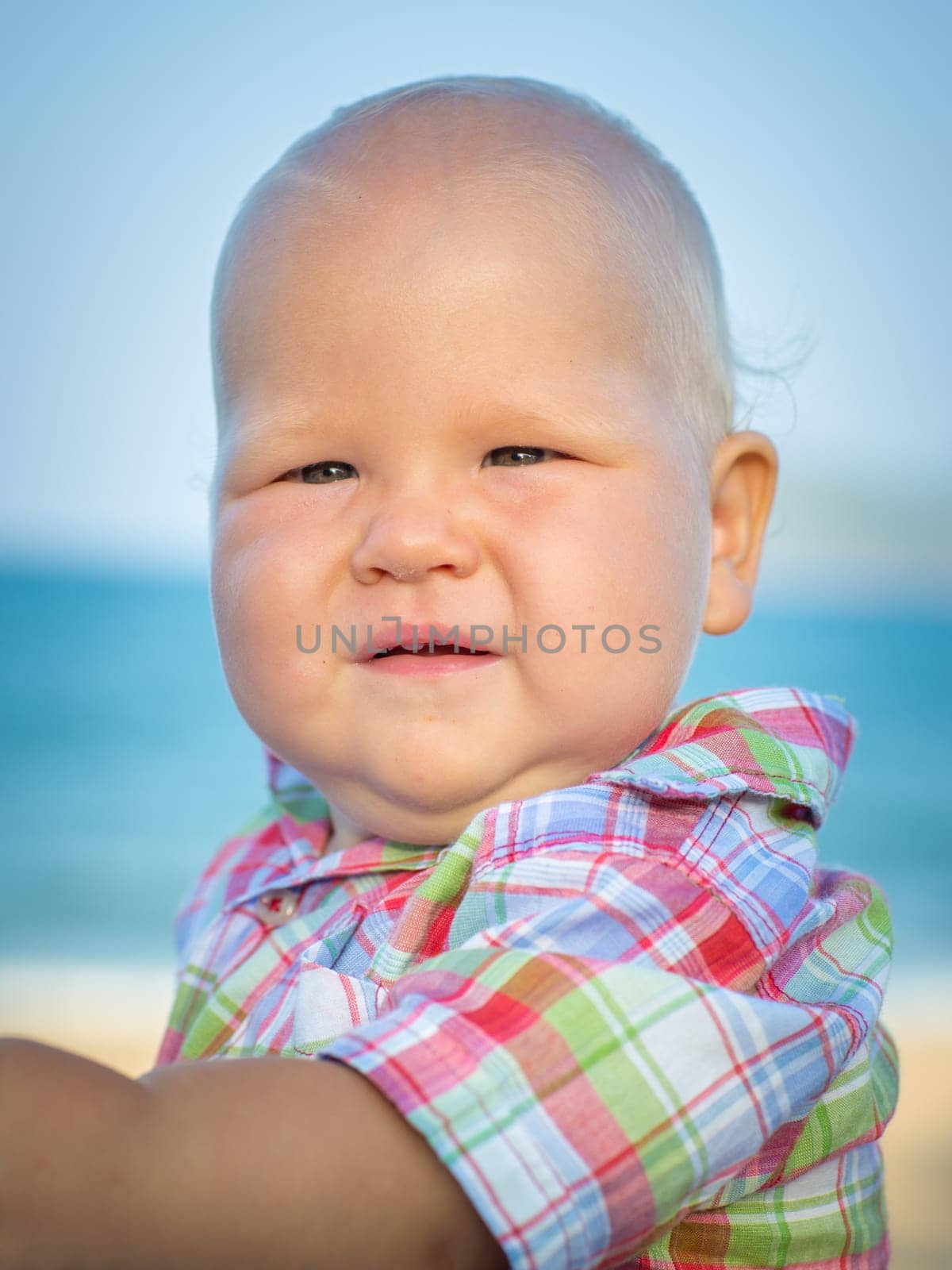 Cute baby on the tropical beach