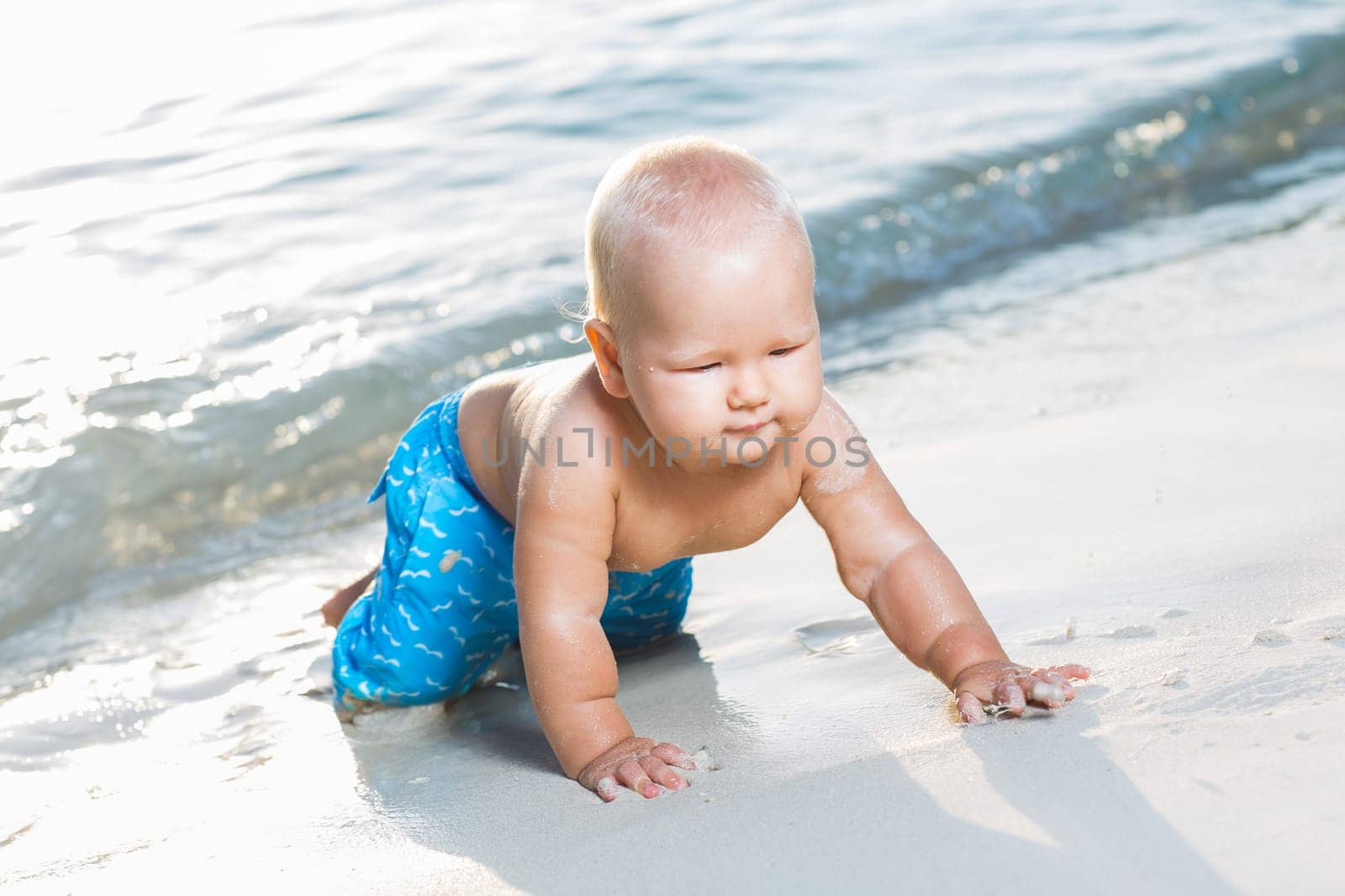 Cute baby on the tropical beach