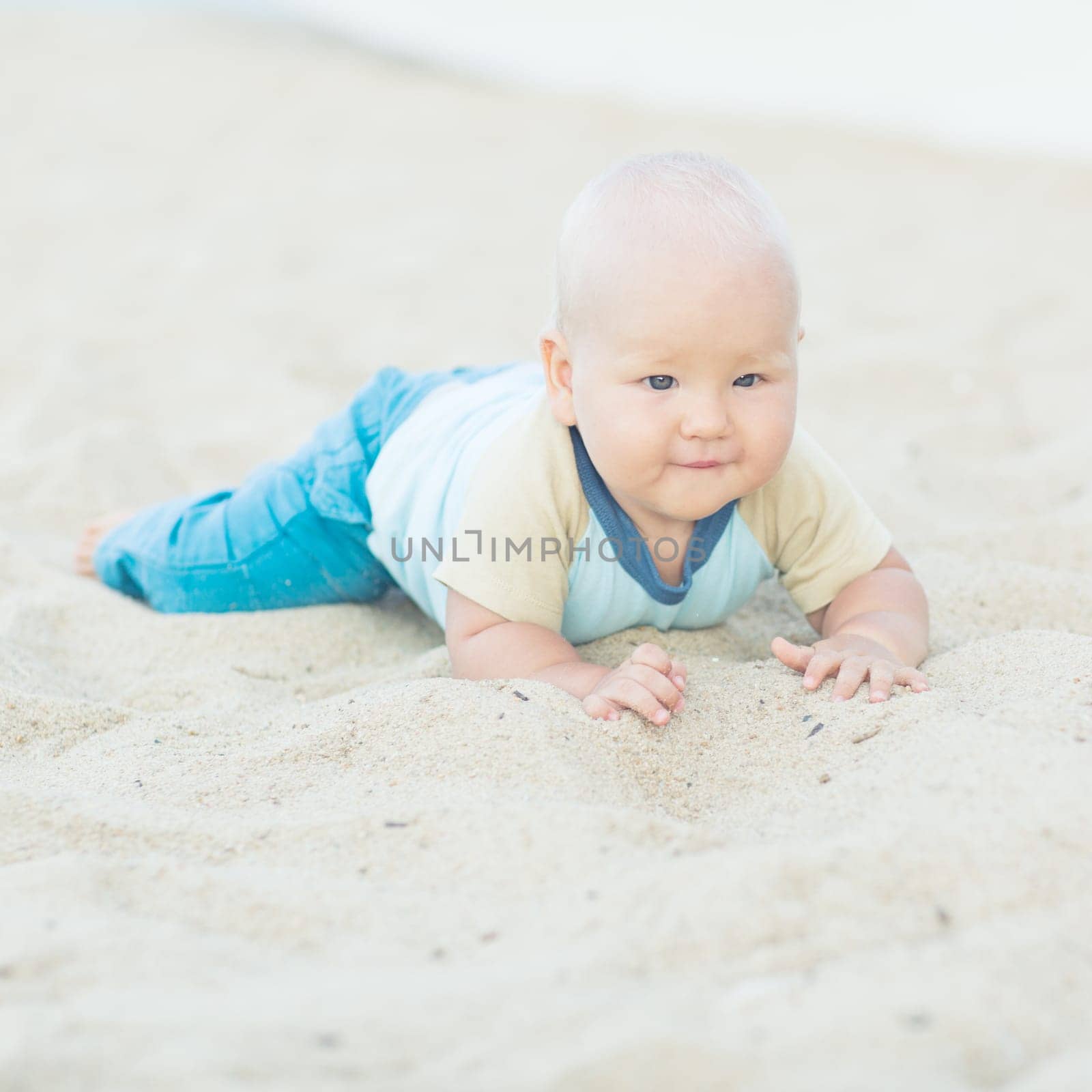 Cute baby on the tropical beach