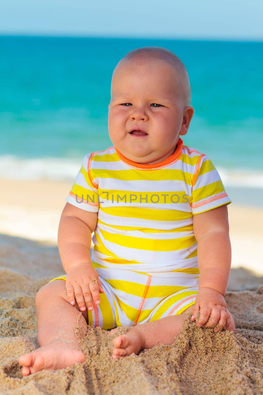 Cute baby on the tropical beach