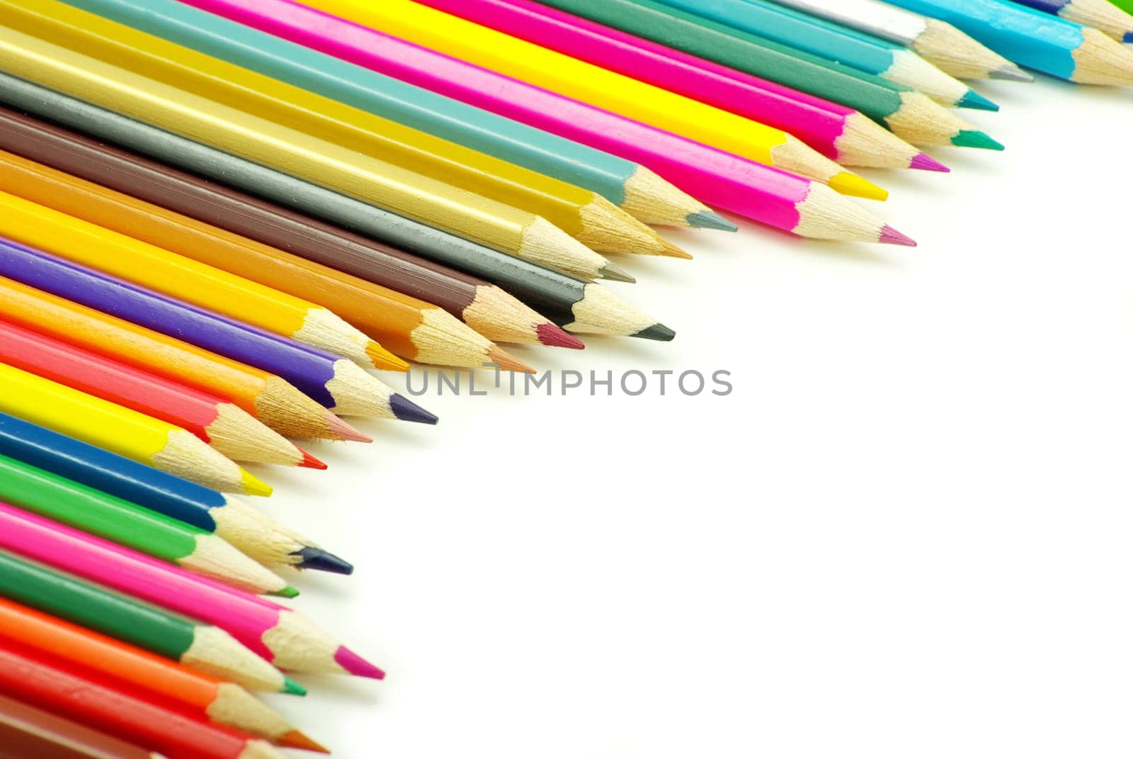 Assortment of coloured pencils  on white background