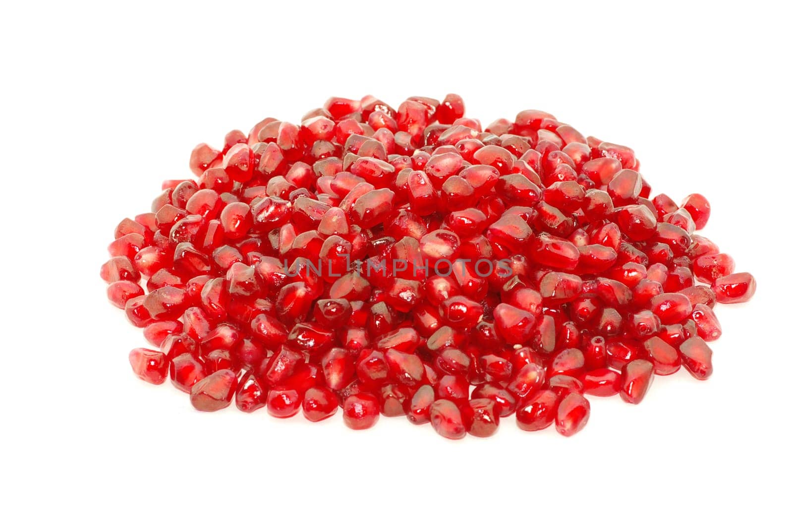 Some pomegranate berries isolated on the white background