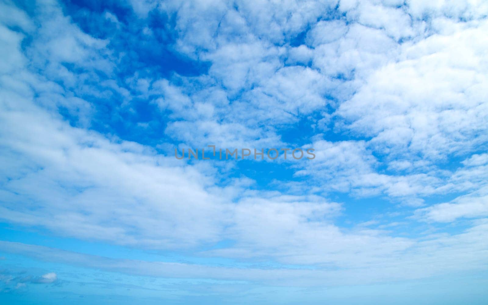 blue sky background with a tiny clouds