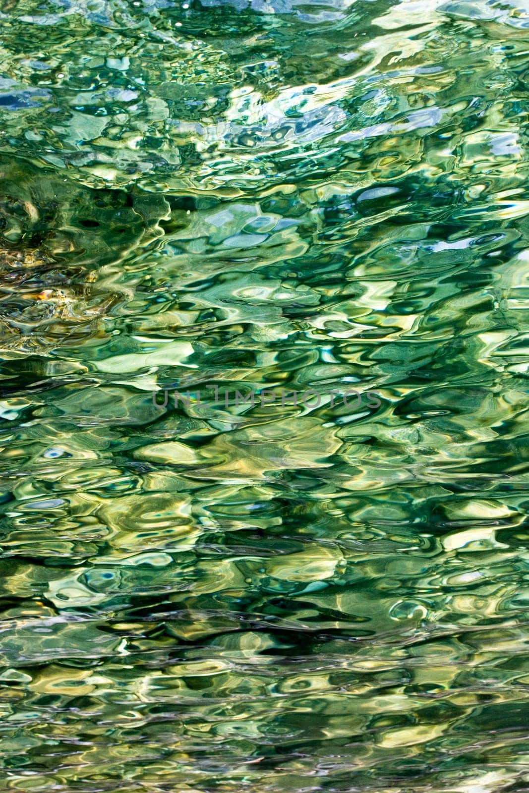 Rocks show through clear waters of the mediterranean