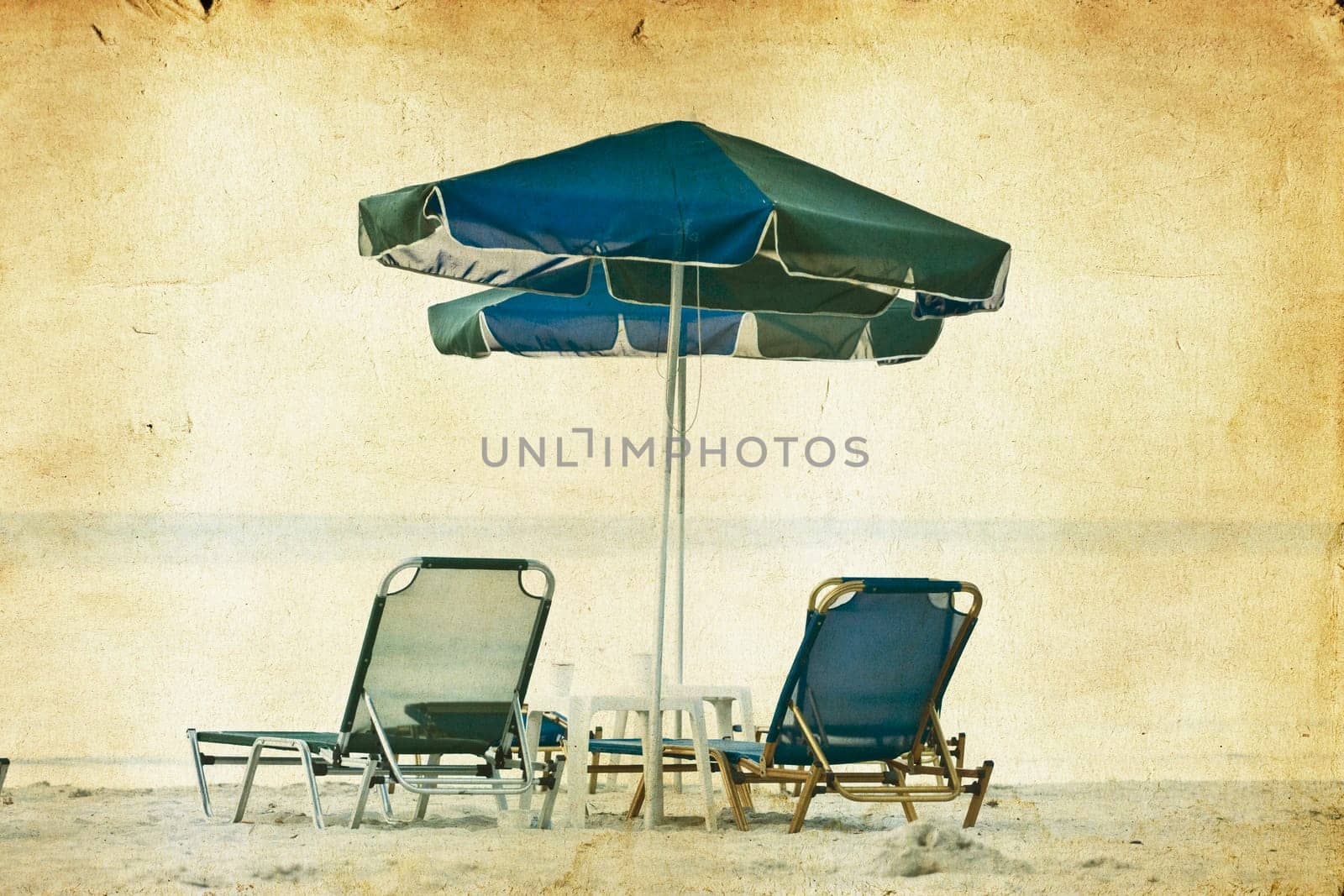 Vintage photo of chairs and umbrellas on the beach
