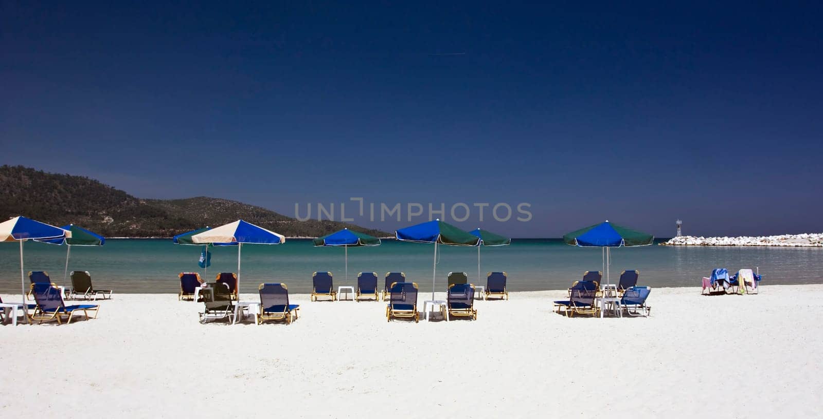 Vintage photo of chairs and umbrellas on the beach