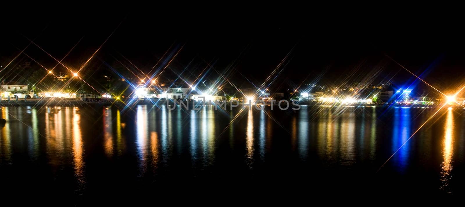 Night coastline, view of a village in Greece