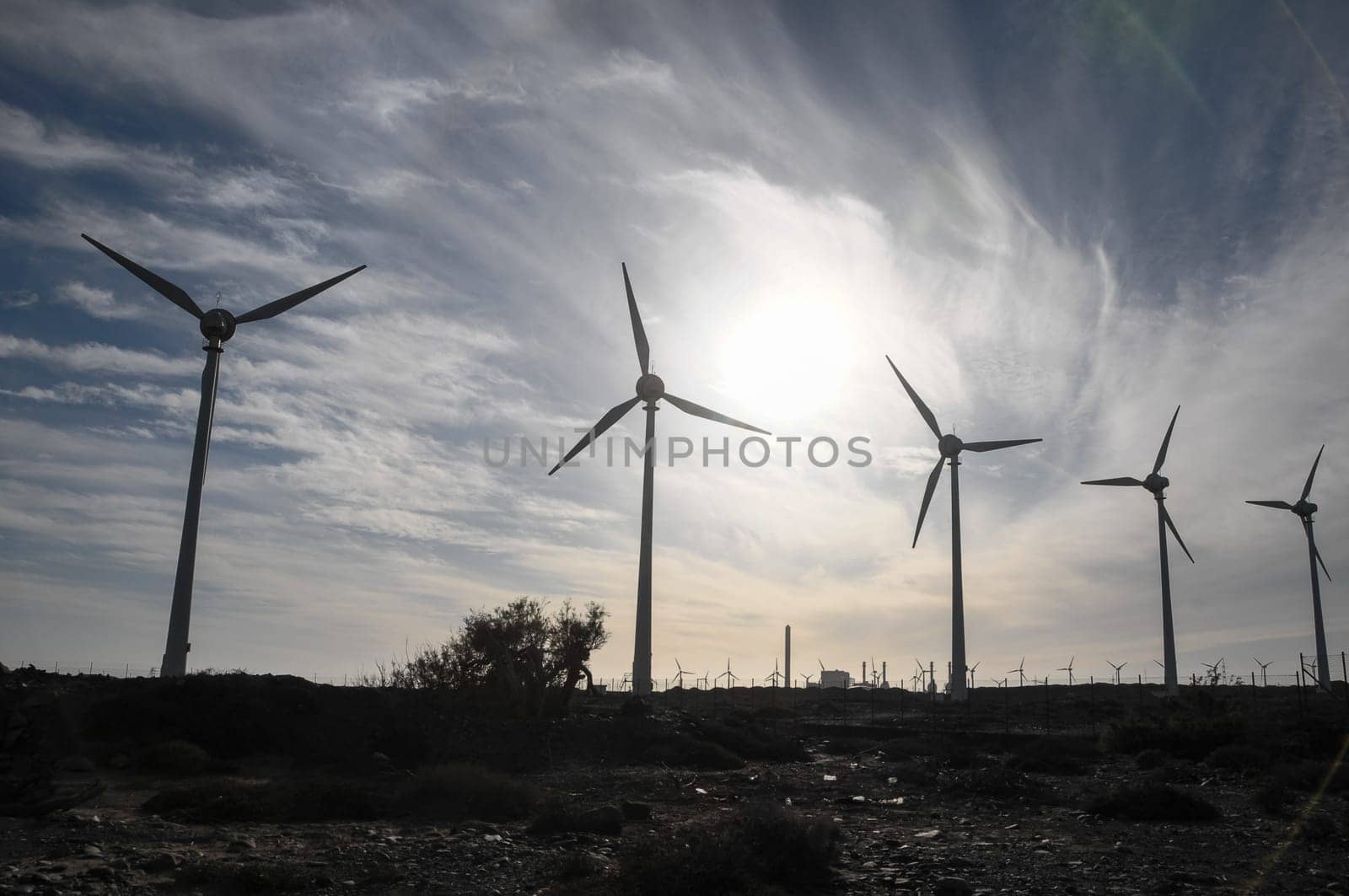 Eletric Power Generator Wind Turbine over a Cloudy Sky