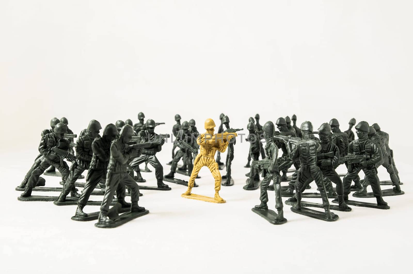 Plastic Lead Soldiers Representing War on a White Background