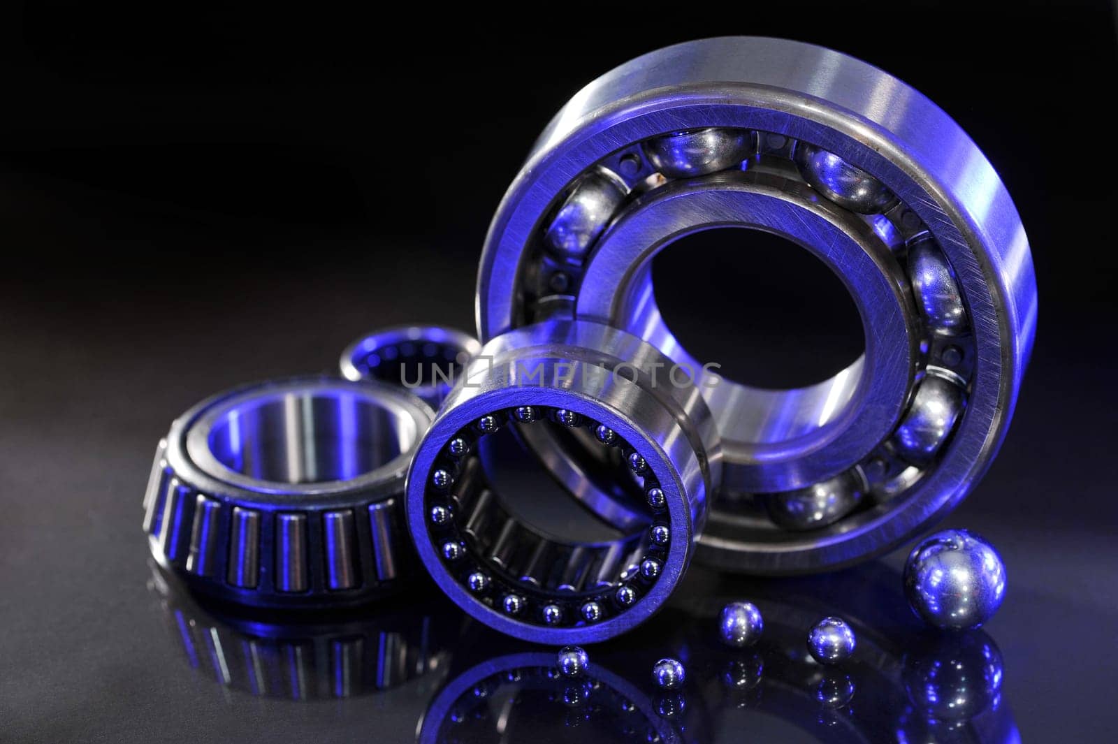 Close-up of various ball bearings in UV light