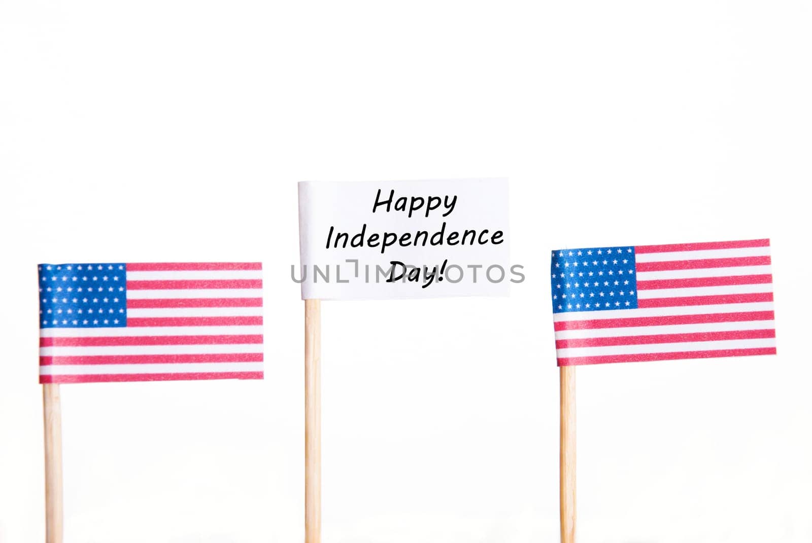 White Banner with Happy Independence Day and two American Flags besides, Isolated