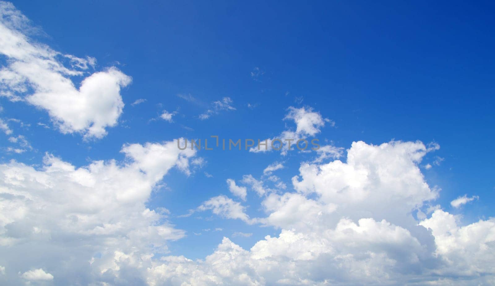 blue sky with clouds and sun