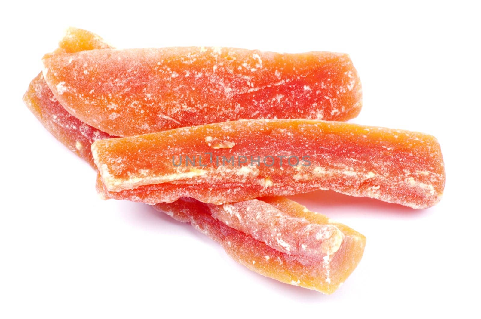 orange dried papaya slices over white background