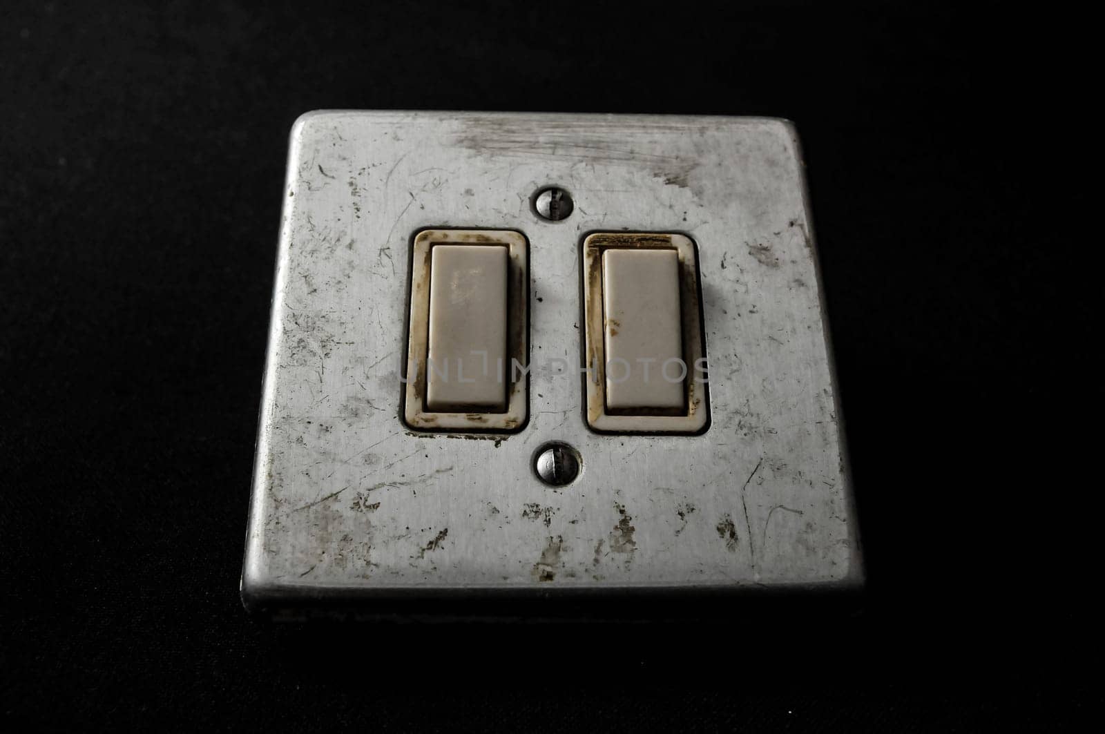 Light switch, old-style on a Black Background