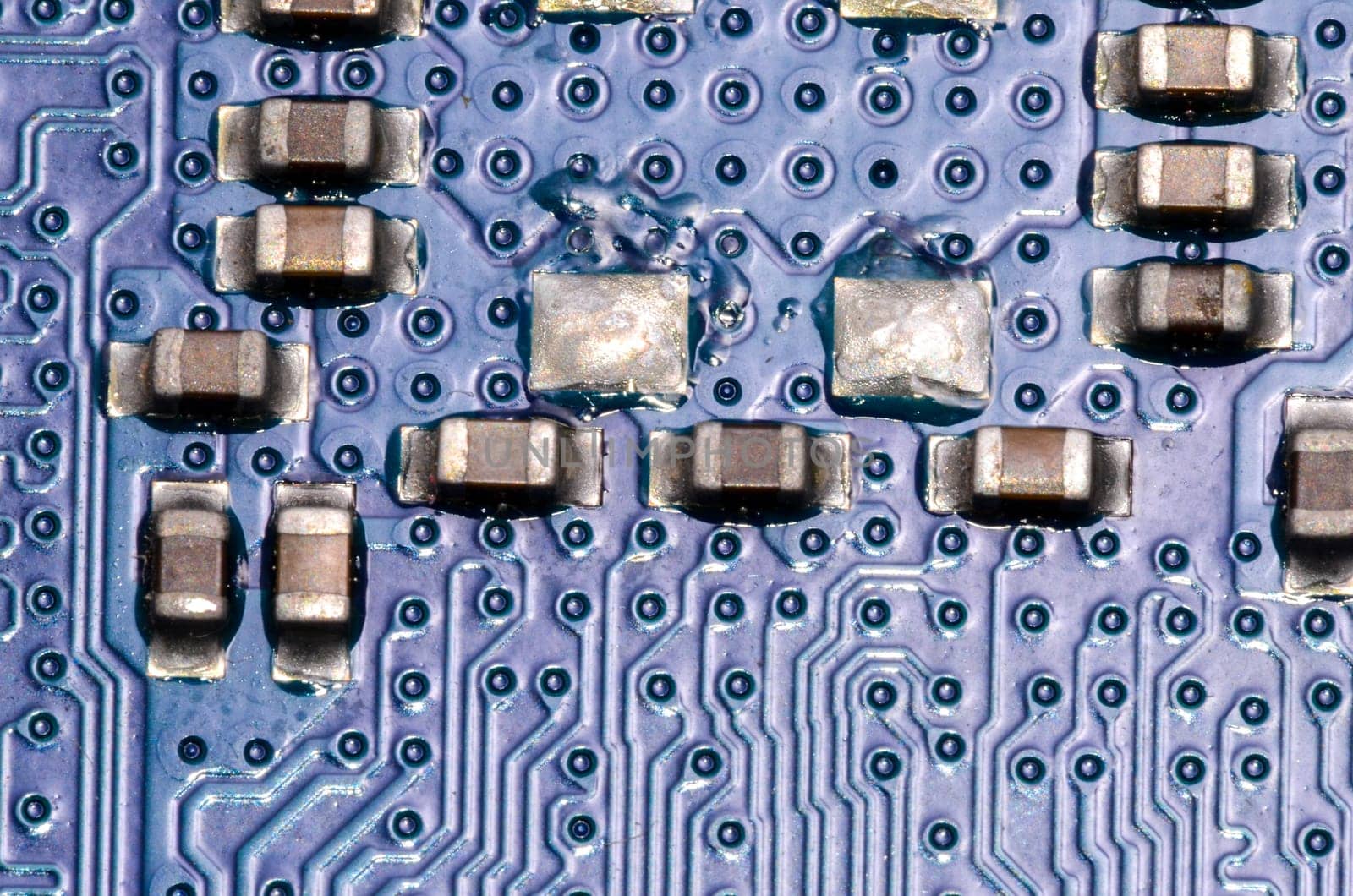 Macro Photo Of Electronic Circuit. Pcb On The Lighting.
