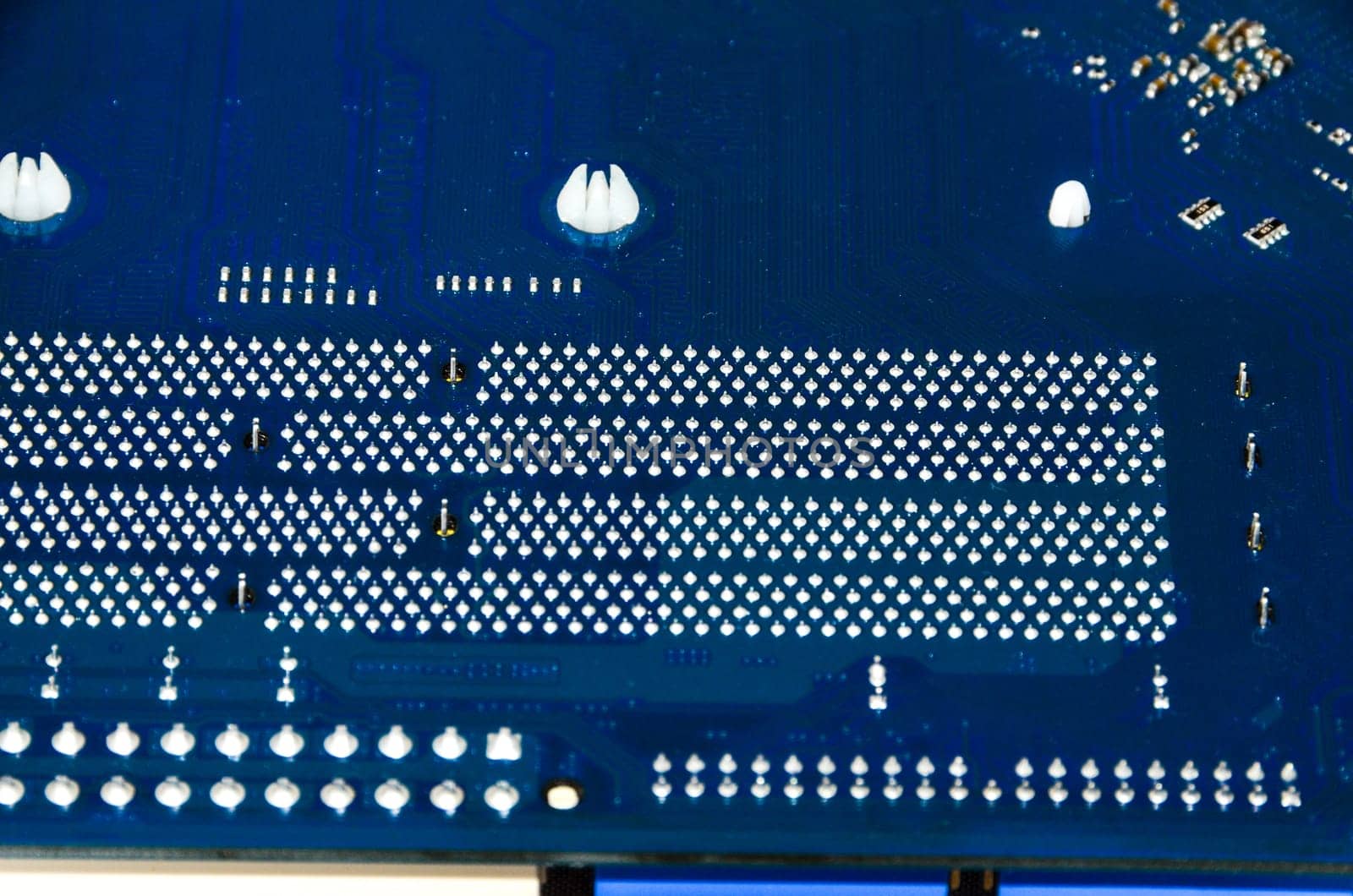 Macro Photo Of Electronic Circuit. Pcb On The Lighting.