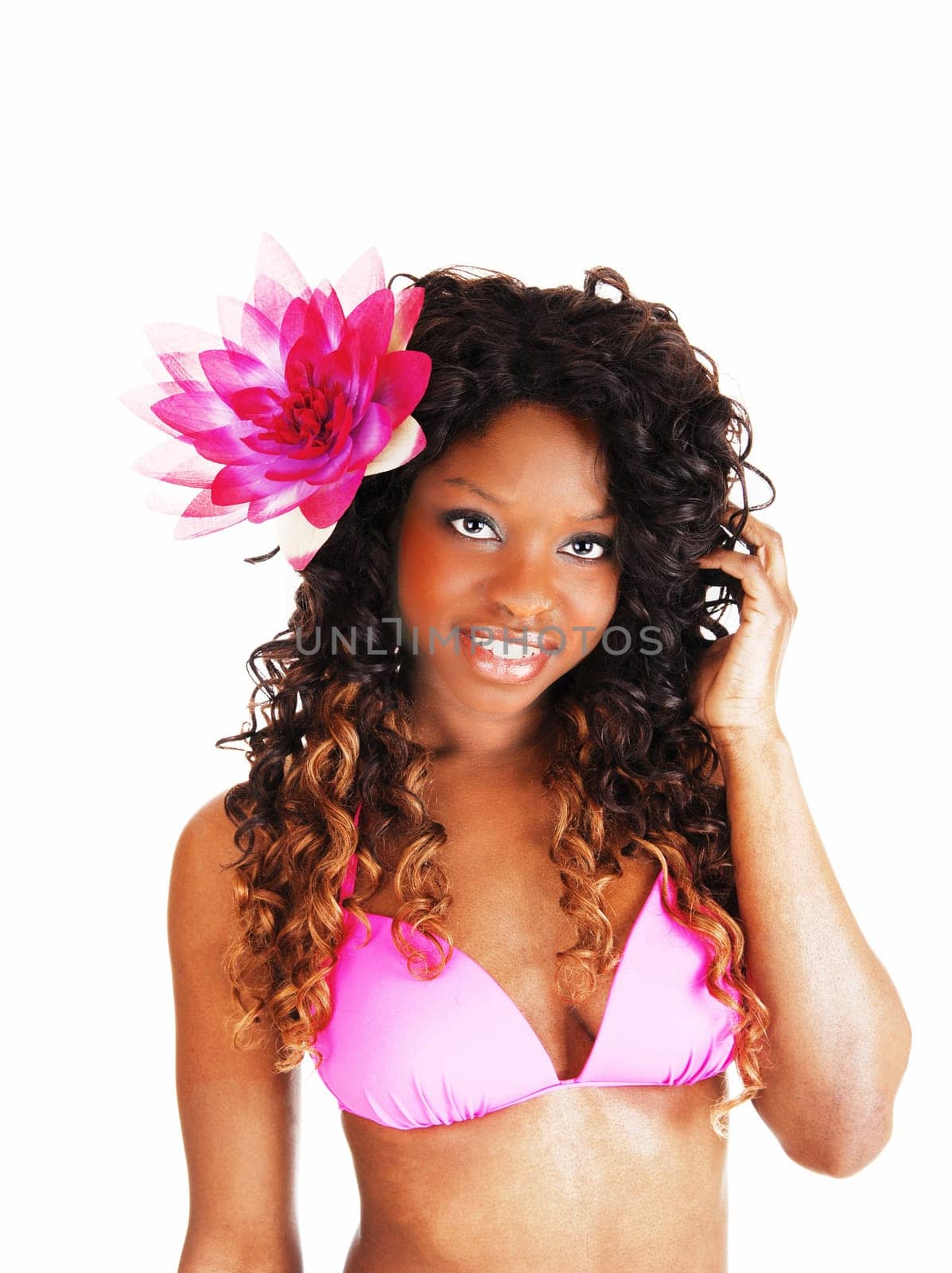 A portrait picture of a lovely Jamaican woman in a pink bikini and a.flower in her curly hair, isolated for white background..