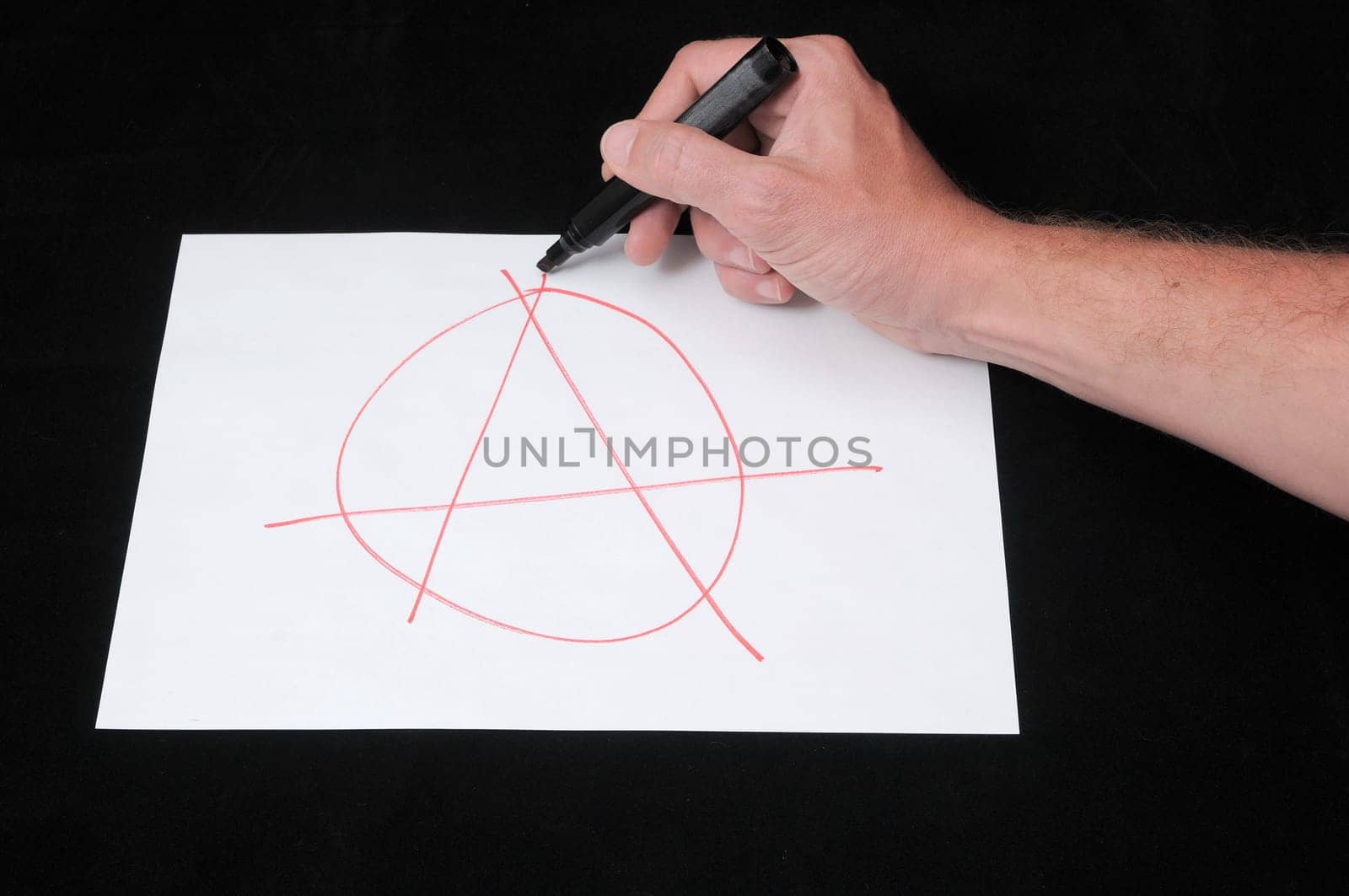 A Caucasian Male Hand Drawing on a White Paper