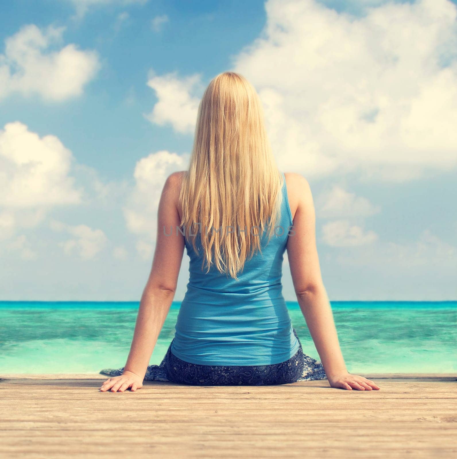 Woman looks out to sea