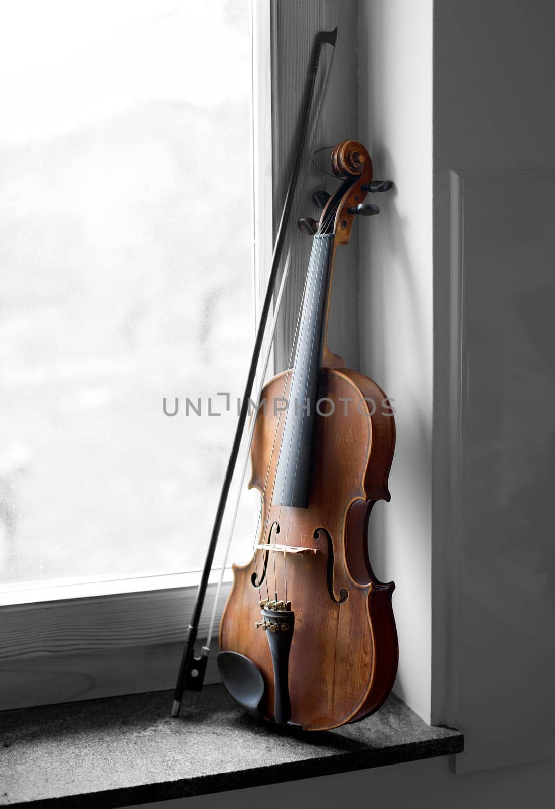 Violin beside window light close up shoot