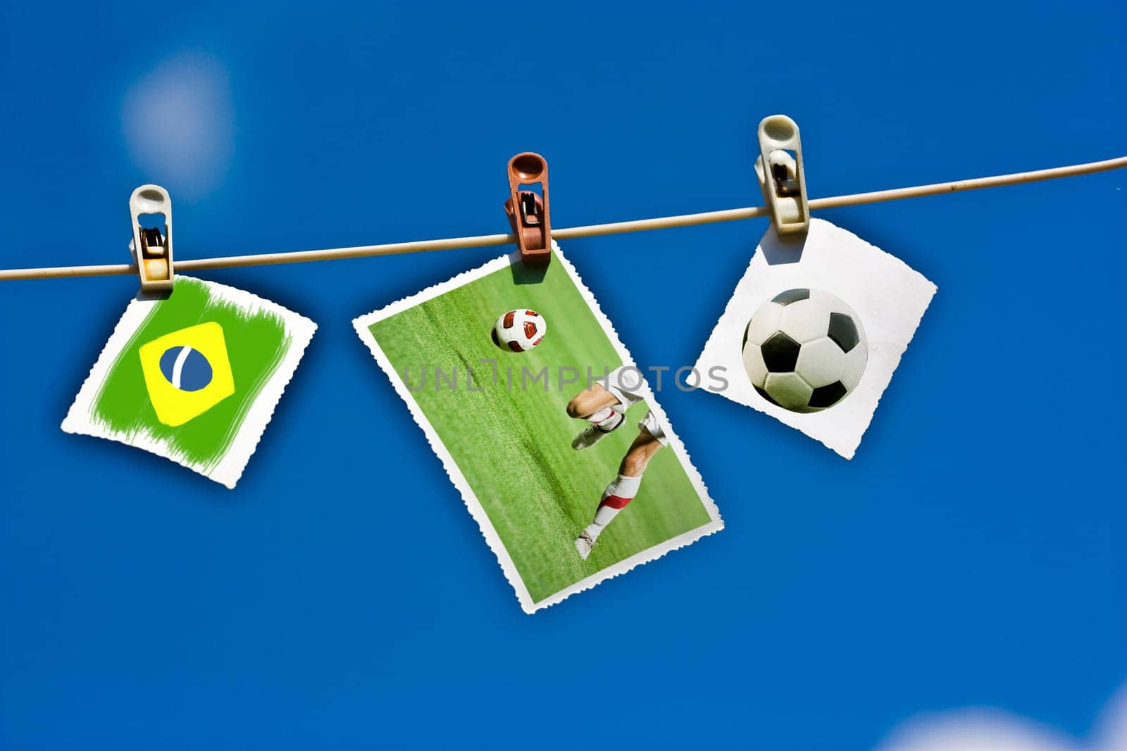 Photos of soccer ball, player and Brazil flag hanging on clothesline