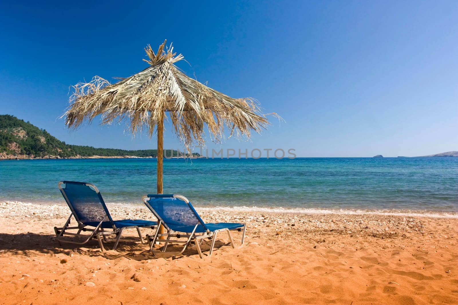 Vintage photo of chairs and umbrellas on the beach
