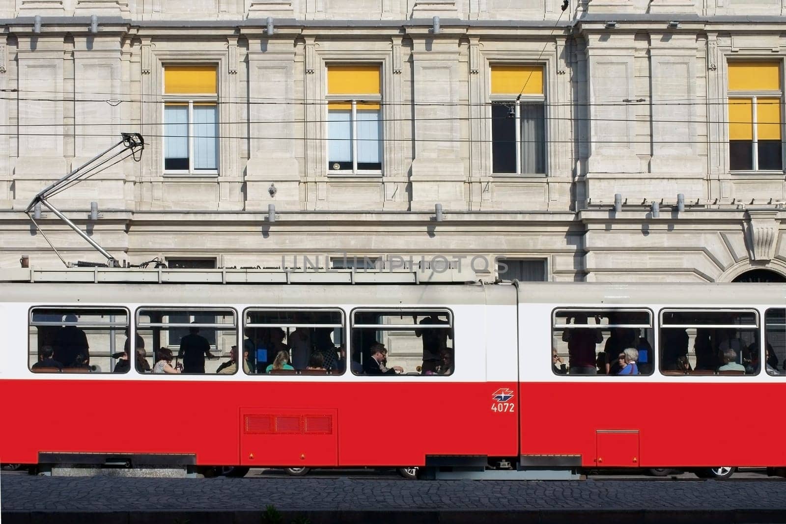 Vienna,Austria – March 30,2014: The tram in the centre of the city of Vienna with passengers at the windows on 30 March 2014 in Vienna.