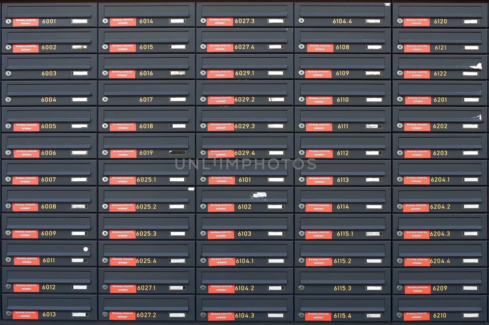 The photograph of lockers or stacked and rowed letterboxes.