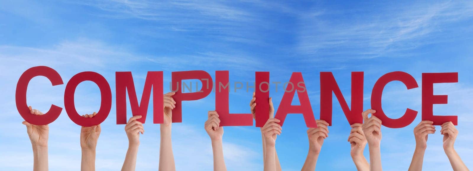 hands holding four pieces of a puzzle with copy space, gray background