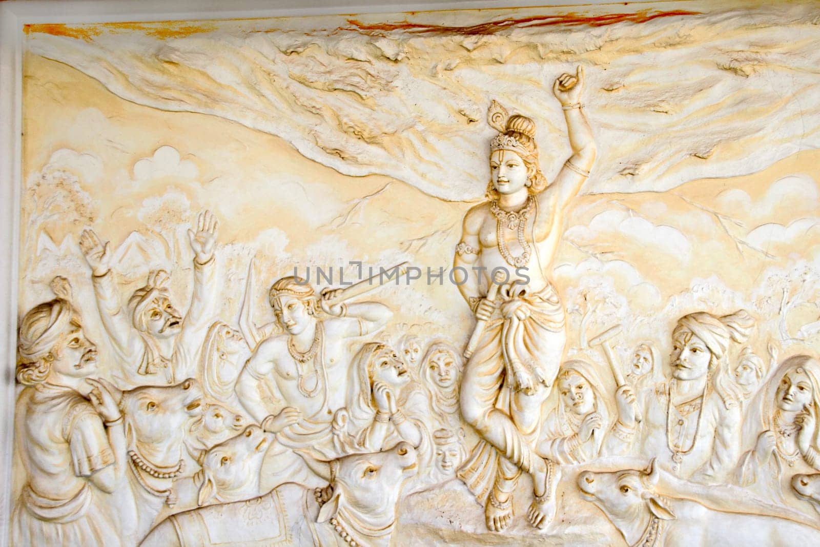 Bas relief sculpture of Lord Krishna lifting mountain Govardhangirii at Shaktinagara Gopalakrishna Temple, Mangalore, Karnataka, India, Asia