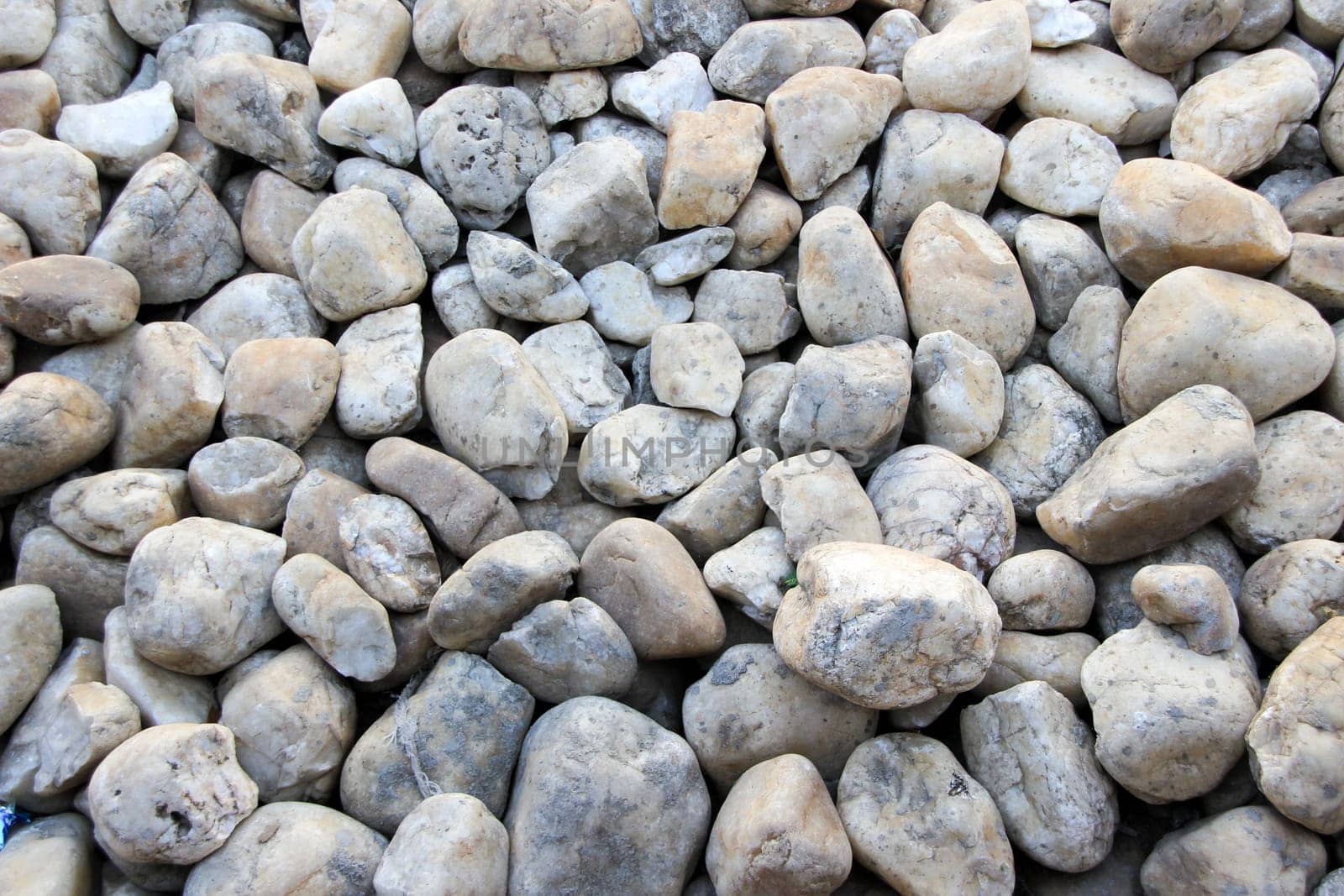 Pavement laid with round edged, grey and pink pebbles