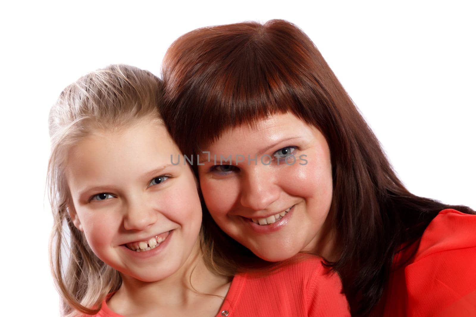 Mother and daughter smiling on a white background