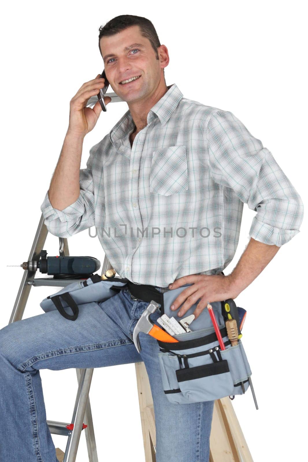 Carpenter posing by ladder