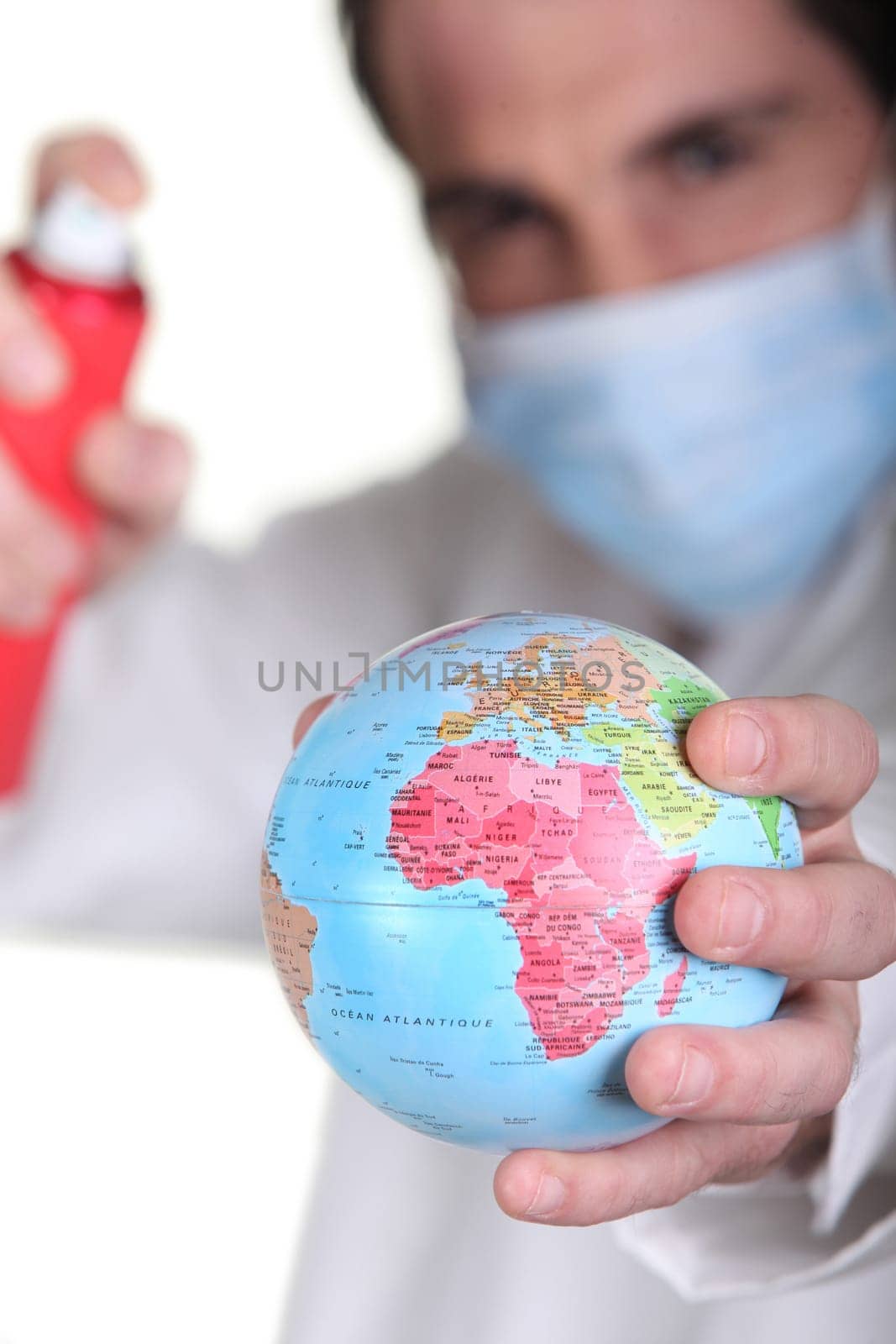 Doctor holding miniature globe