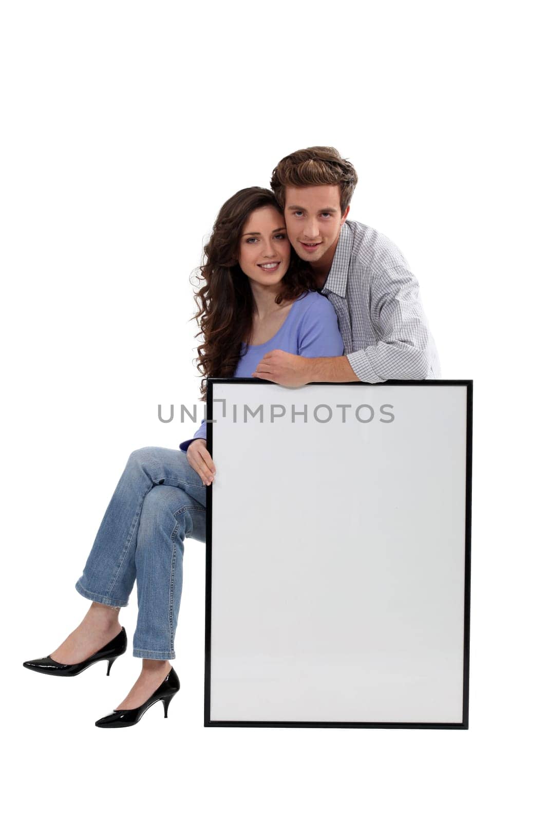 a couple and a white panel/ copyspace