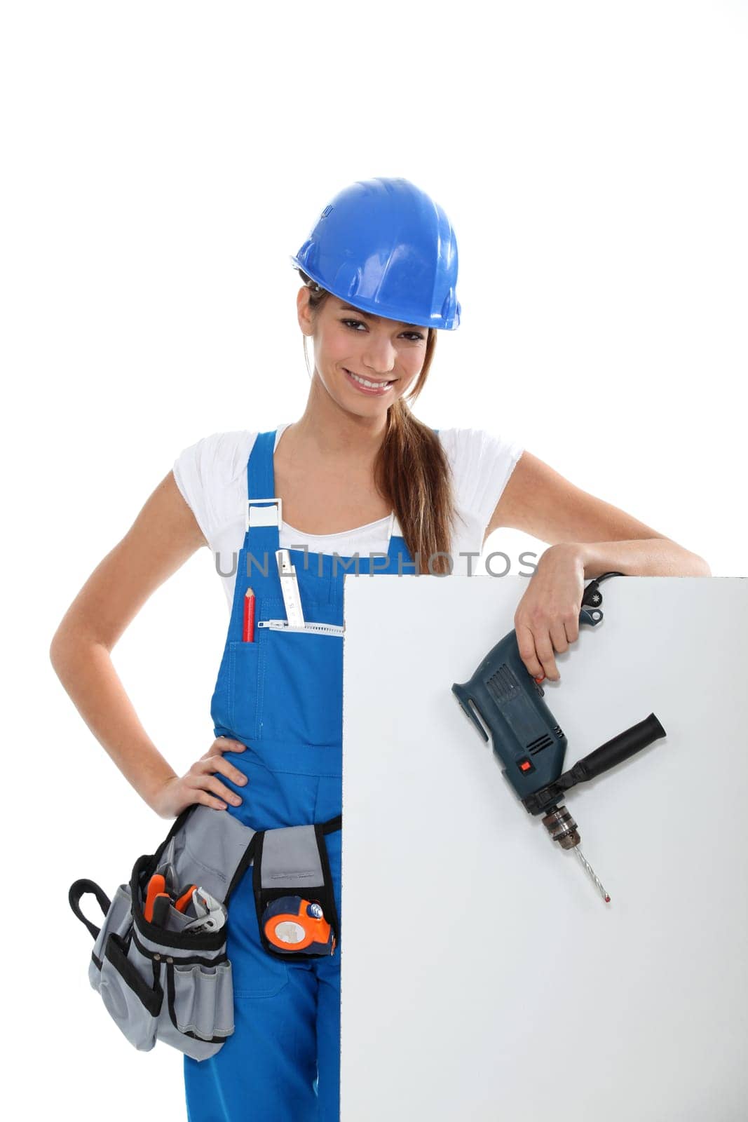 Woman with a drill and a blank board